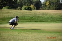 Squatting Golfer